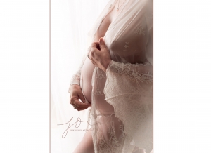 Side on baby bump in white lace. Captured by New Generation Portraits