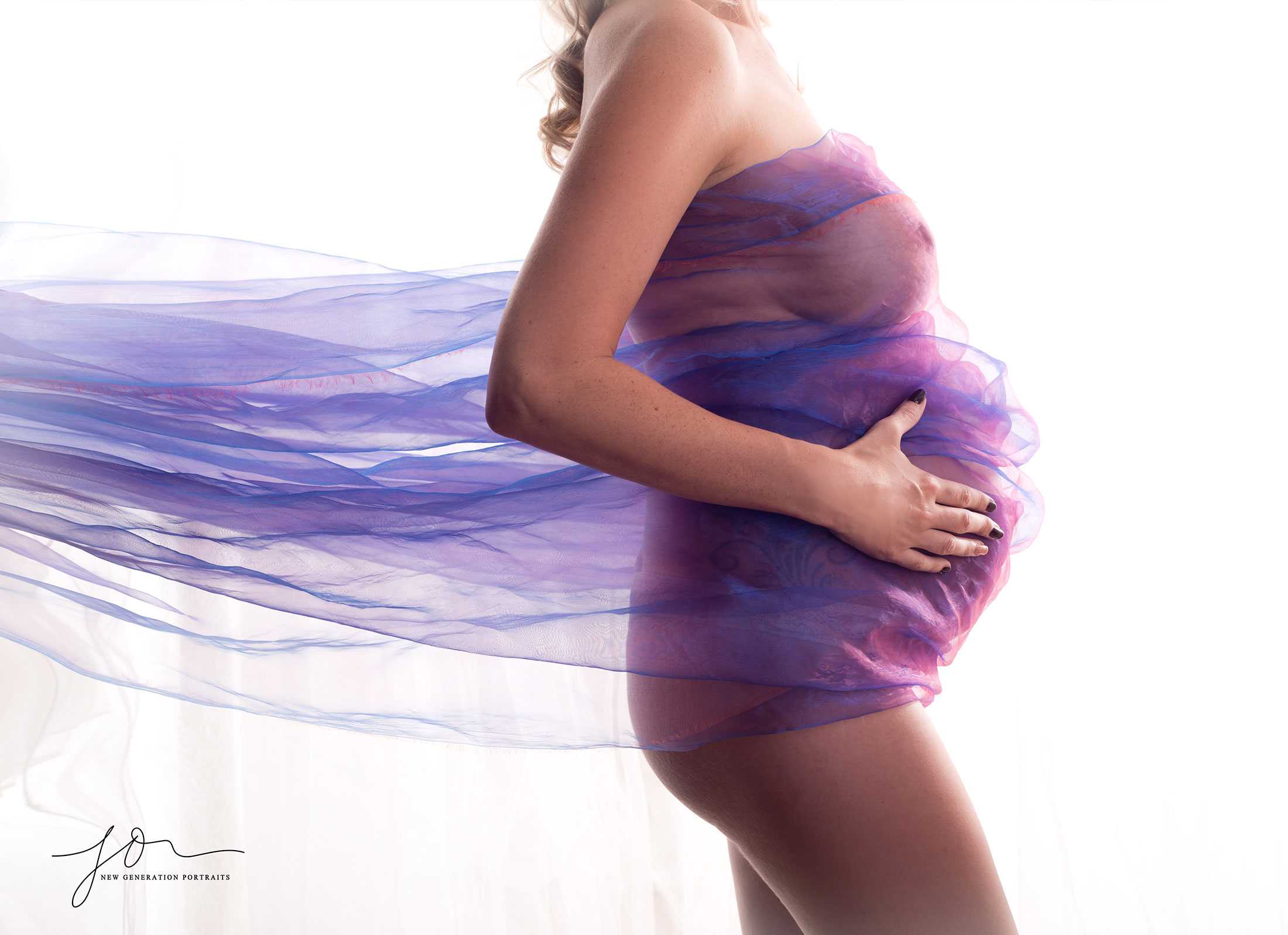 Baby bump covers by purple fabric. Captured by New Generation Portraits