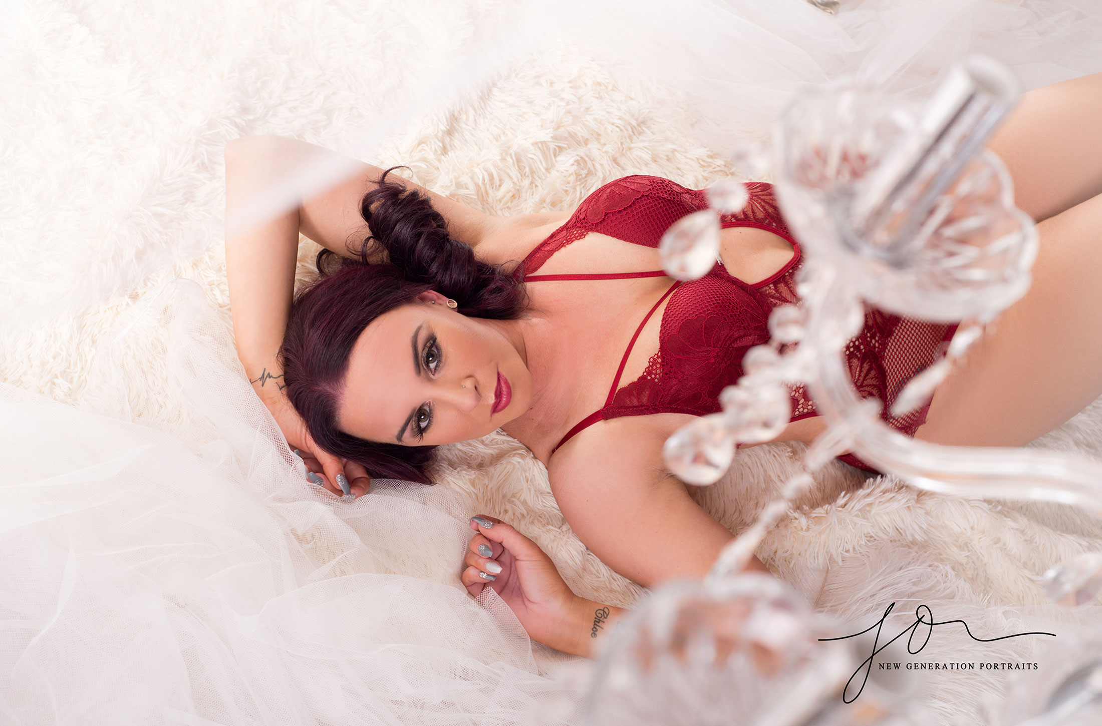 Boudoir confidence shoot. Wirral boudoir. Shooting through chanderlier. Captured by New Generation Portraits