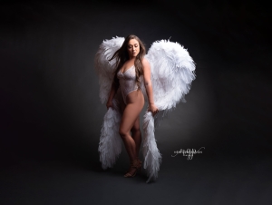 Powerful boudoir photography using angel wings. Captured by New Generation Portraits