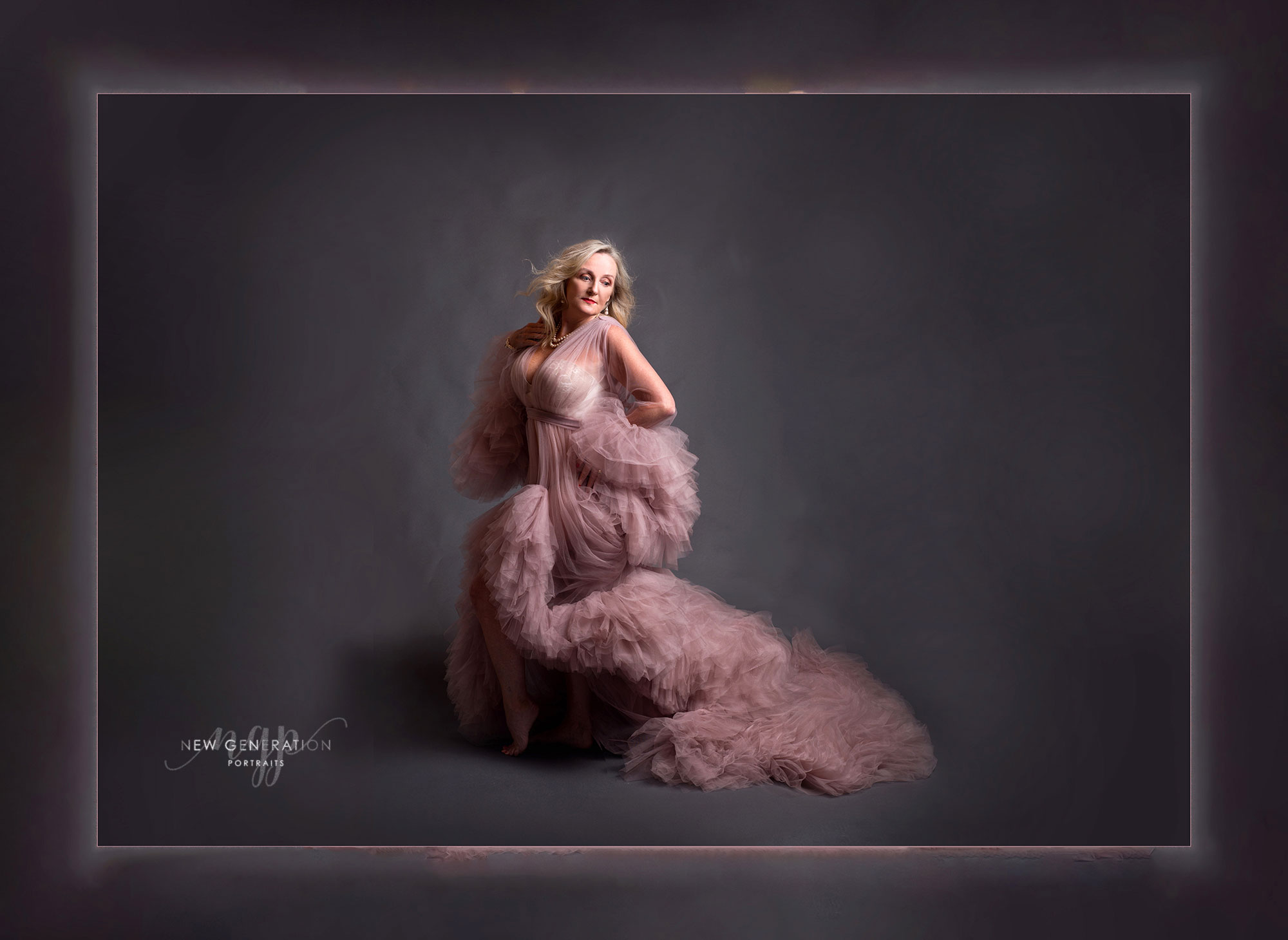 Beauty boudoir in pink gown on grey background. Captured by New Generation Portraits